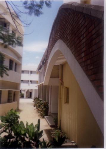 vista between the auditorium and the main building looking at the plyground beyond